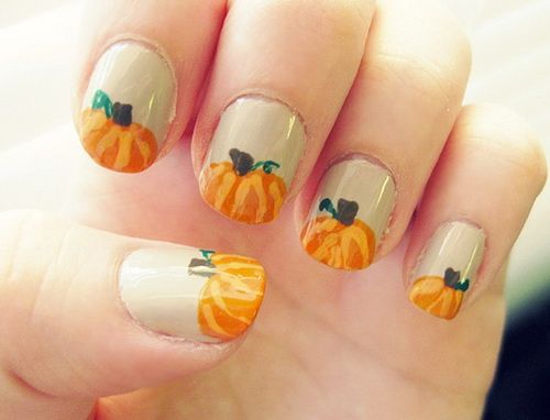 Yellow pumpkin nail art design