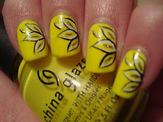 yellow nail designs on black hands